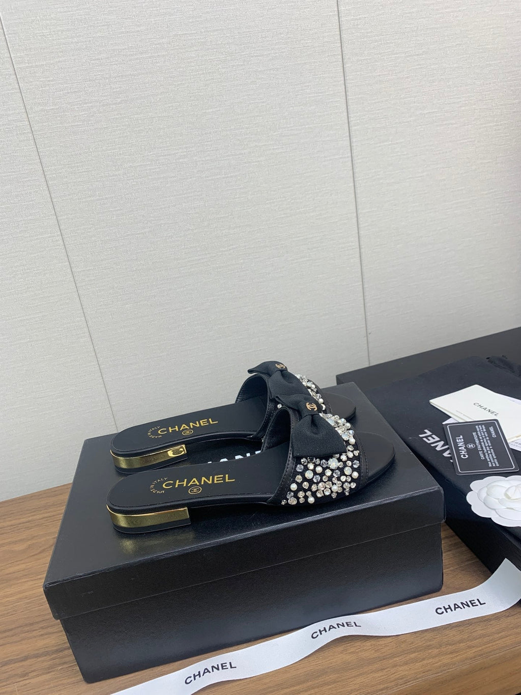 CHANEL BOW SLIPPERS IN BLACK LAMBSKIN WITH RHINESTONES